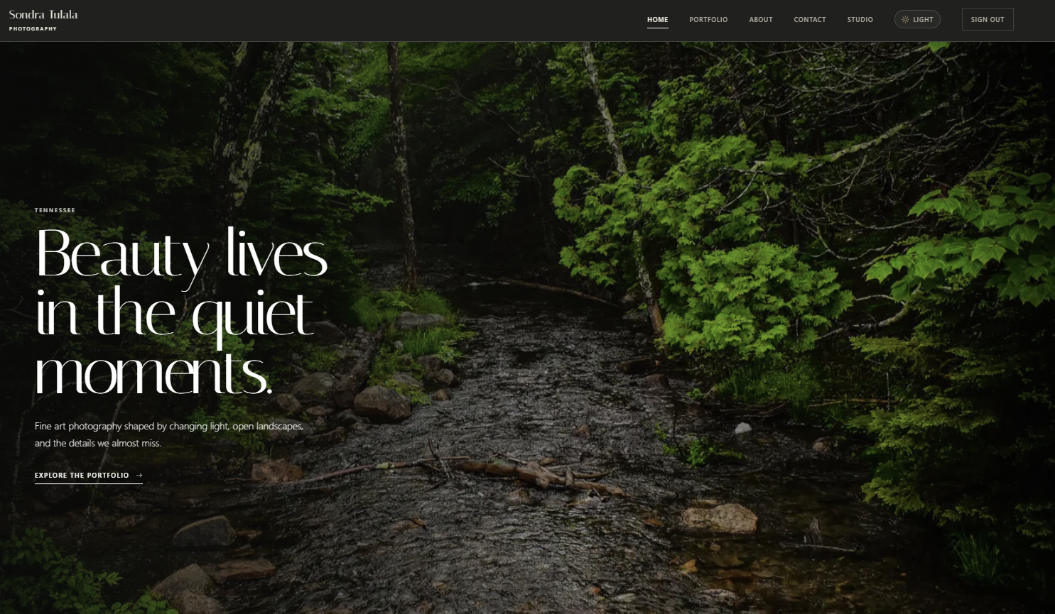 Sondra Tulala Photography immersive homepage featuring a forest stream